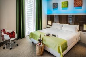 Postel nebo postele na pokoji v ubytování Hotel degli Arcimboldi + 33 fotografií