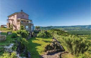 a house on top of a hill with a green yard at Amazing Home In Pasini With 4 Bedrooms, Internet And Outdoor Swimming Pool in Livade