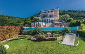 a house on a hill with a yard at Amazing Home In Pasini With 4 Bedrooms, Internet And Outdoor Swimming Pool in Livade