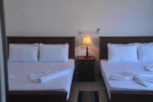 Postel nebo postele na pokoji v ubytování Nethum Beach House