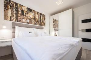 Posteľ alebo postele v izbe v ubytovaní Divat Apartments - Central Smart Homes