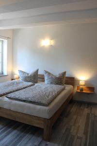 Postel nebo postele na pokoji v ubytování Apartments Ackerbürgerhof No. 9