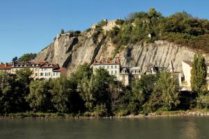 a town on a hill next to a body of water at Grenoble hyper-centre + WiFi + Netflix in Grenoble