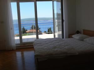 Posteľ alebo postele v izbe v ubytovaní Apartments Petricevic