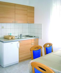 Kuchyňa alebo kuchynka v ubytovaní Apartments Petricevic