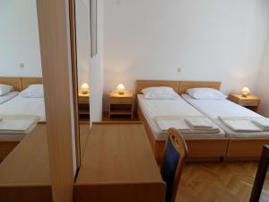 Posteľ alebo postele v izbe v ubytovaní Apartments Petricevic