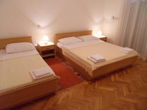 Posteľ alebo postele v izbe v ubytovaní Apartments Petricevic