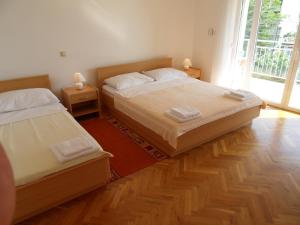 Posteľ alebo postele v izbe v ubytovaní Apartments Petricevic + 34 fotografií