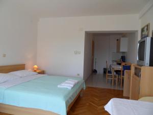 Posteľ alebo postele v izbe v ubytovaní Apartments Petricevic