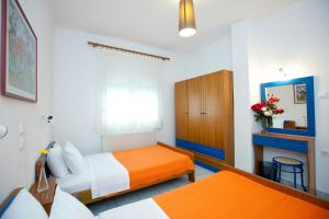 Säng eller sängar i ett rum på Yiouli Hotel