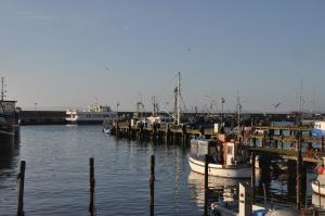 a group of boats docked at a dock in the water at Fürstenhof Sassnitz in Sassnitz