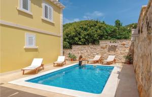 a villa with a swimming pool in the middle of a building at Beautiful Home In Blato With 6 Bedrooms, Wifi And Outdoor Swimming Pool in Prizba