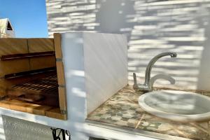 Kuchyňa alebo kuchynka v ubytovaní La Baula Terraza, Boutique Apartament + 28 fotografií