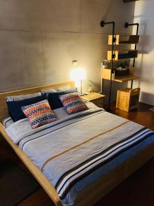 Postel nebo postele na pokoji v ubytování Sinnan12 Homestay桃園市民宿059號