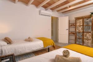 Postel nebo postele na pokoji v ubytování Casa En Grenyo, Javea