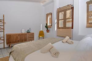 Postel nebo postele na pokoji v ubytování Casa En Grenyo, Javea