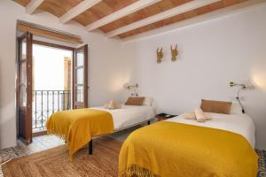 Postel nebo postele na pokoji v ubytování Casa En Grenyo, Javea
