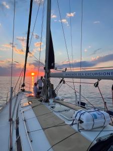 a group of people on a sail boat in the ocean at Anagram Hotel in M&yacute;konos City