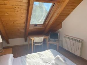 A bed or beds in a room at Atico El Mirador de Sallent