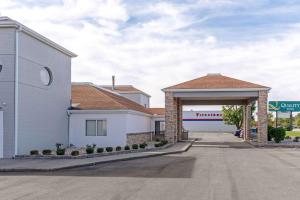 a building with a parking lot with a garage at Quality Inn - Fairborn in Fairborn