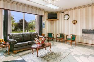 a living room with a couch and a table at Inn at York in York