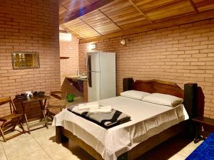 Llit o llits en una habitació de Chalés Marinelli em São Roque