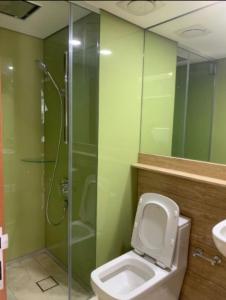 a bathroom with a shower and a toilet and a sink at Cozy 2BR Suite 2 Min to KLCC and Saloma bridge in Kuala Lumpur