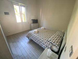 A bed or beds in a room at M.G Home a un passo da tutto