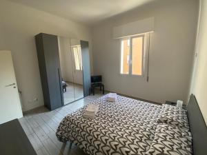 A bed or beds in a room at M.G Home a un passo da tutto