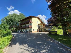 a large house on the side of a road at Schönblick in Oberaichwald