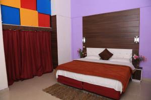 Voodi või voodid majutusasutuse Prince Hotel Mallroad toas