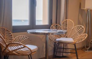 a table and chairs and a table and a table and chairs at Palm Beach in Ajaccio