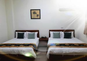 Postel nebo postele na pokoji v ubytování YehSir B&B