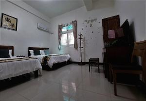 Postel nebo postele na pokoji v ubytování YehSir B&B