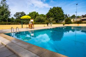 The swimming pool at or close to CreaConfort - Casa do Rio