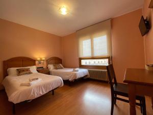 Postel nebo postele na pokoji v ubytování Hostal Torreblanca
