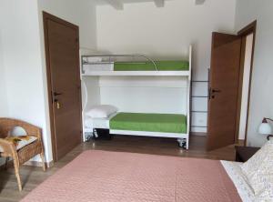 A bed or beds in a room at Casa Montefiore 13 LT nella tranquilla campagna Marchigiana