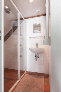 a bathroom with a sink and a shower at Le Cottage, Maison paysanne au cœur du Vexin in Écos +34 photos