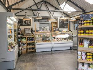 a store filled with lots of food and drinks at Irt Cottage in Seascale