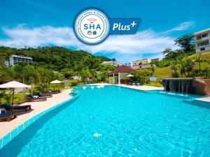 
a swimming pool with a swimming pool table and chairs at PS Hill Resort - SHA Plus in Patong Beach

