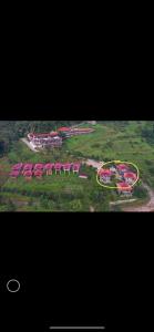 an aerial view of a resort with red roofs at Phumektawan ภูเมฆตะวัน Hotel&Restaurant in Mae Salong