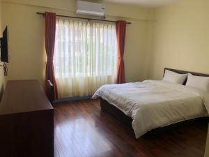 Postel nebo postele na pokoji v ubytování HOTEL CLAIRE INN