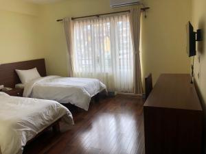 Postel nebo postele na pokoji v ubytování HOTEL CLAIRE INN