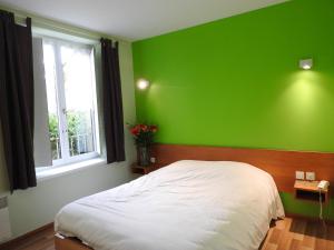 Postel nebo postele na pokoji v ubytování Au Bon Gîte
