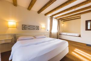 Postel nebo postele na pokoji v ubytování Hotel Relais Vecchio Maso
