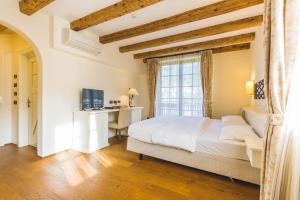 Postel nebo postele na pokoji v ubytování Hotel Relais Vecchio Maso