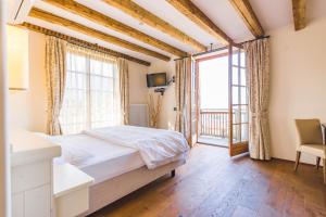 Postel nebo postele na pokoji v ubytování Hotel Relais Vecchio Maso