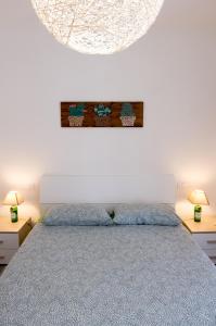 Posteľ alebo postele v izbe v ubytovaní 60mt dal mare