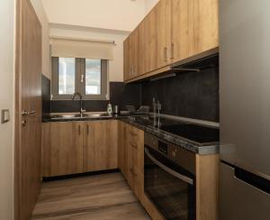 Kuchyň nebo kuchyňský kout v ubytování CARLOS MANSION LUXURY SUITES