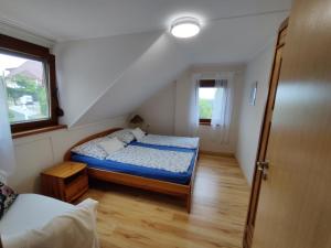 Postel nebo postele na pokoji v ubytování Bertalan Apartman